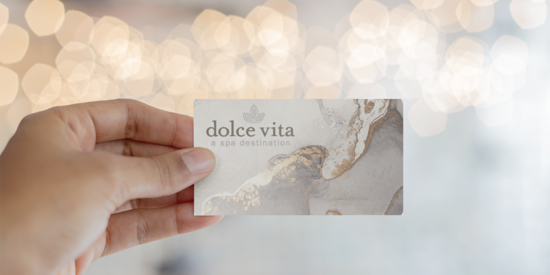 mockup-of-a-business-card-being-held-against-blurred-lights-21915 (1)