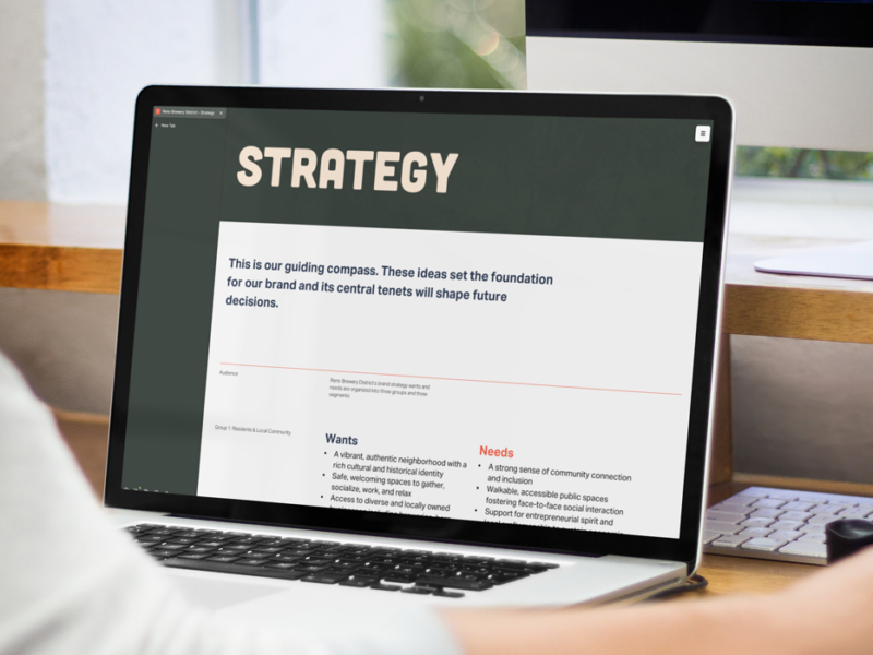person reading brand strategy on a laptop